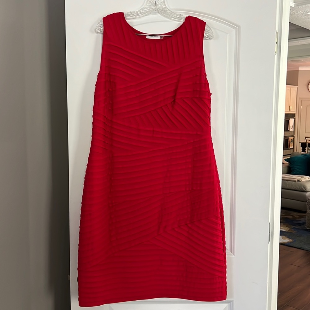 The perfect shade of red with a sweet shape and fit. This dress is a gem.